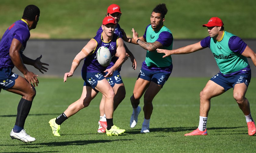 Harry Grant passes at training as Brandon Smith looks on as the Storm prepare for Friday's qualifying final against Manly.