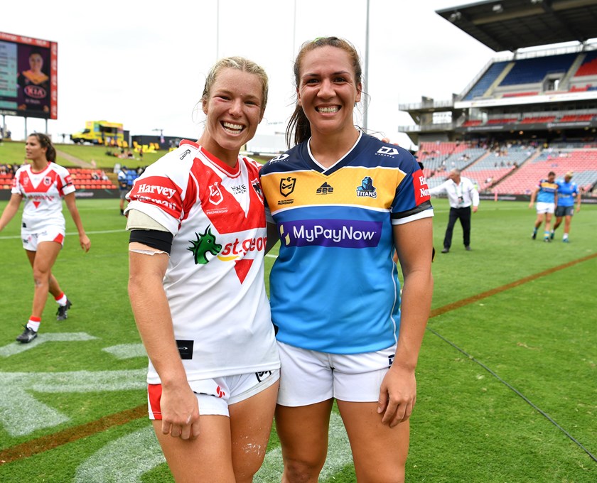 Former Australian rugby sevens teammates Emma Tonegato and Evania Pelite embrace after the game on Sunday.