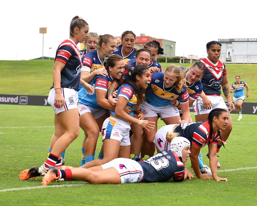 The Titans celebrate a try during their historic defeat of the Roosters