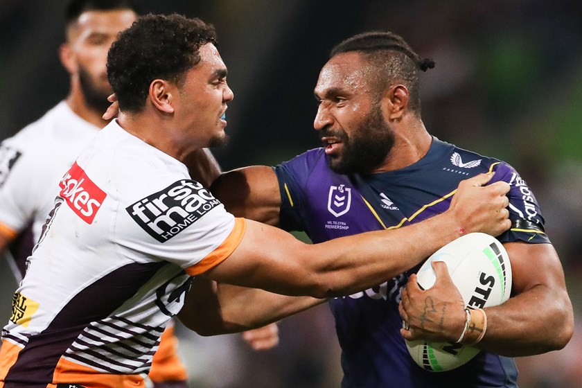 Xavier Coates tries to handle Justin Olam when they met as opponents in 2021