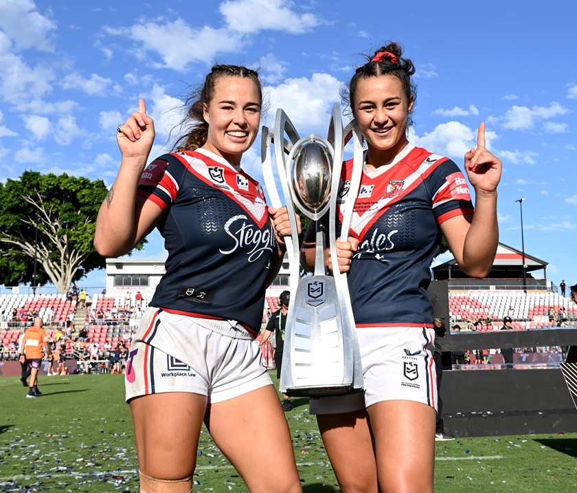 Isabelle Kelly and Corban Baxter celebrate the Roosters' 2021 NRLW title.