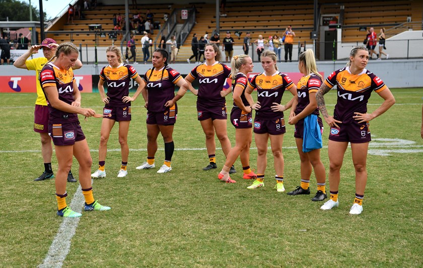 Broncos players including Chelsea Lenarduzzi and Julia Robinson are dejected after fulltime in April this year after going down to the Roosters.