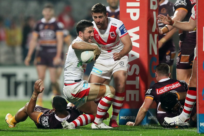 Ben Hunt celebrates a try for the Dragons with Andrew McCullough