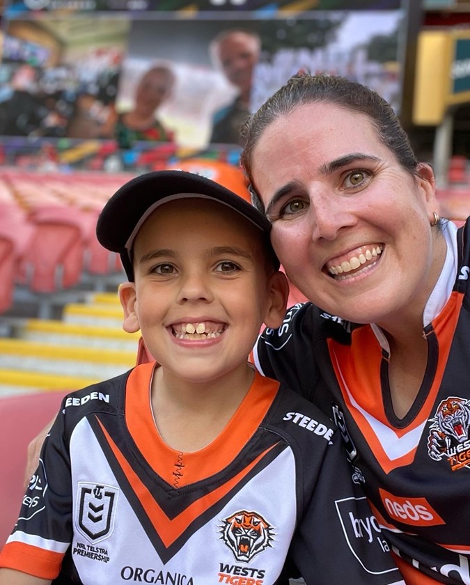 Lachlan and Courtney McShane in the crowd during a Tigers match.