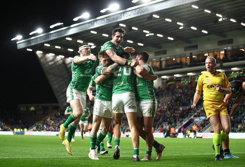 Ireland celebrate the first of Louis Senior's two tries in the game.