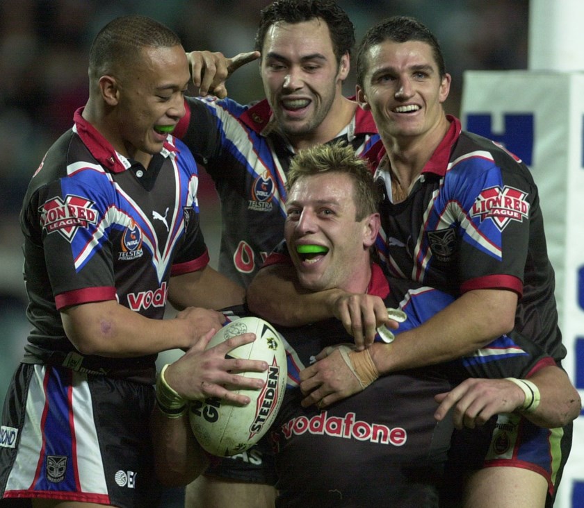 Justin Morgan celebrates a try during the 2002 season with Motu Tony (left), Wairangi Koopu (centre) and Ivan Cleary. ©NRL Photos