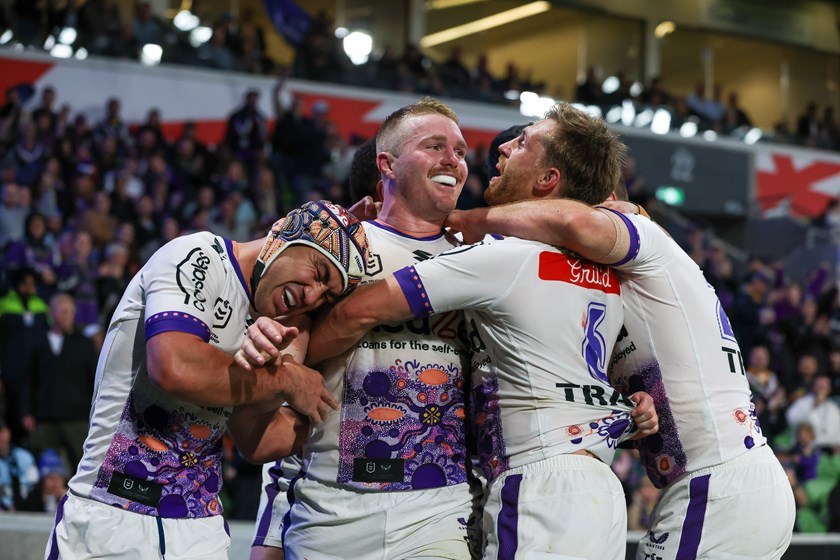 Storm team-mates celebrate a rare try by hard working forward Josh King
