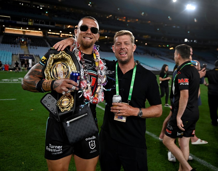 Panthers prop James Fisher Harris carries the belt as he celebrates with three-times world surfing champion Mick Fanning