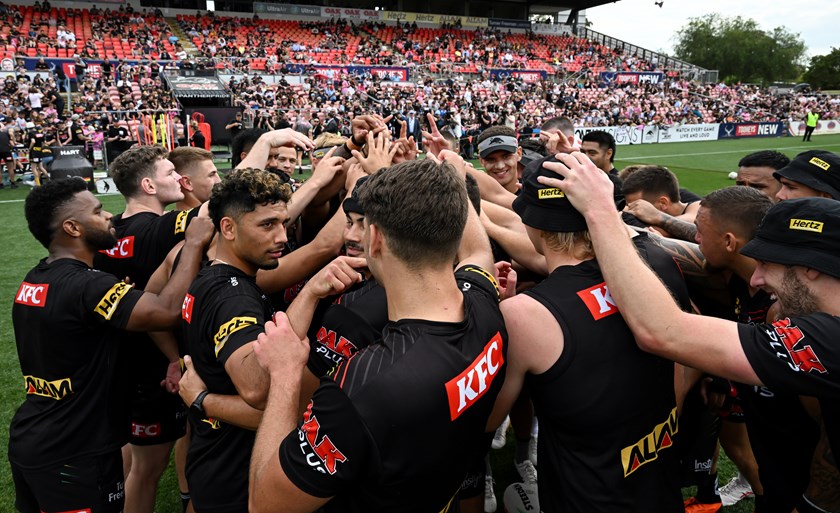 Turuva and the Panthers squad in a huddle during their fan day on Tuesday.