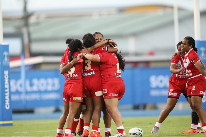Tonga celebrate their shock defeat of 2019 gold medallists Fiji