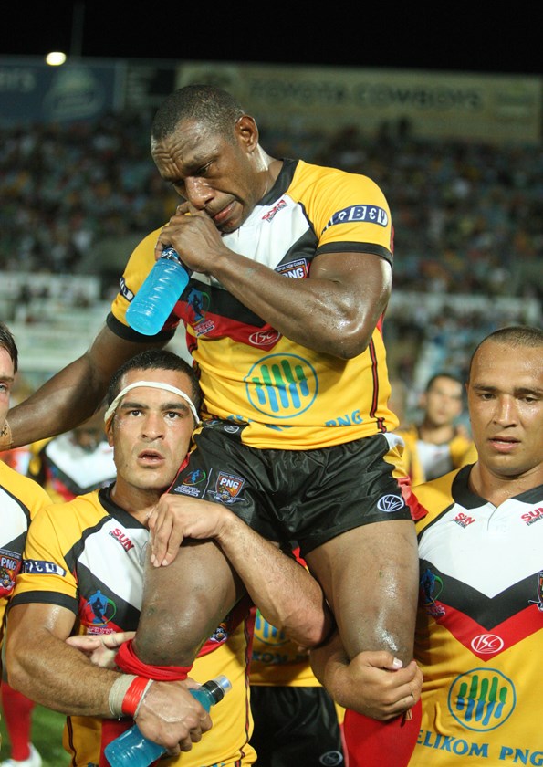 An emotional Stanley Gene is chaired from the field after his final appearance for the Kumuls at the 2008 World Cup