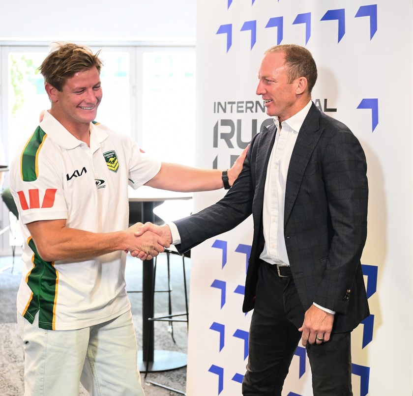 A humble Harry Grant is congratulated by Kangaroos great Darren Lockyer after winning the 2025 Golden Boot - an award Lockyer won twice in 2003 and 2006.
