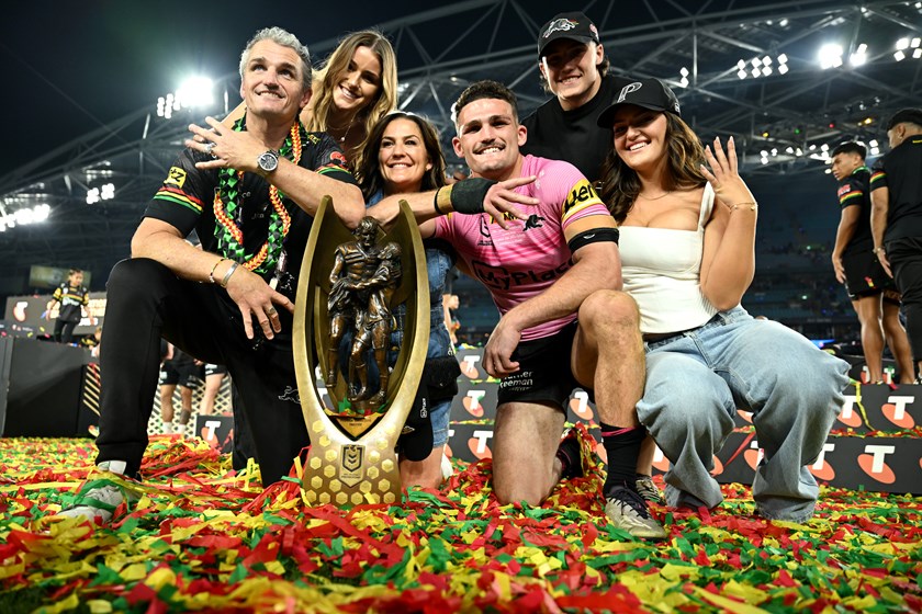 Family men: Ivan and Nathan Cleary soak up their fourth straight premiership with their loved ones.