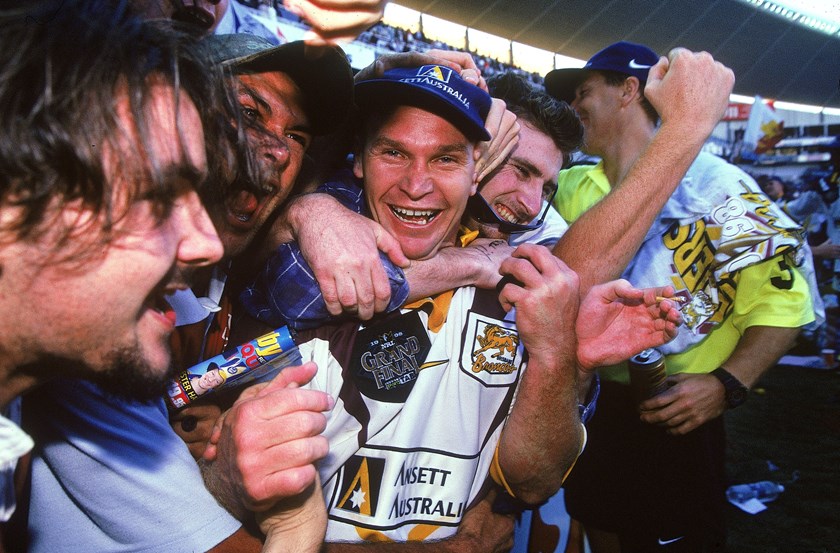 Langer celebrates with Broncos’ fans after the club’s 1998 Grand Final win.