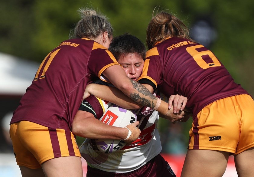 Queensland Country prop Heather Ballinger is stopped in her tracks by the NSW Country defence.
