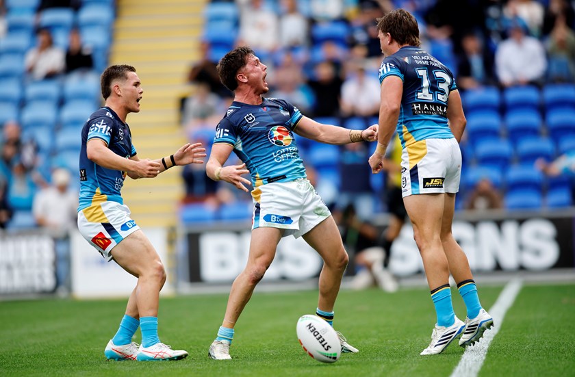 Oliver Pascoe celebrates with Zane Harrison and Chris Randall after scoring against the Sea Eagles.