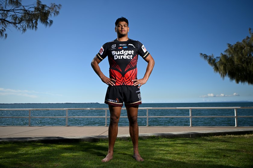 Selwyn Cobbo wears this year's Dolphins Indigenous jersey while at Shorncliffe Pier, on the lands of the  Turrbal people. 