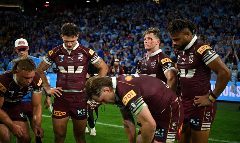 Disappointed Queensland players following the loss in the decider.