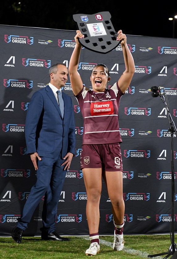 Queensland captain Sienna Lofipo lifts the Under 19 shield.