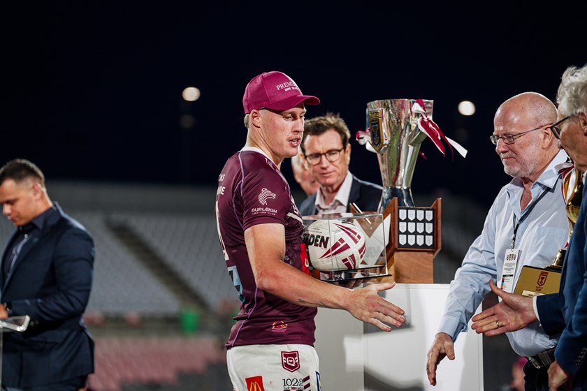 Josh Rogers accepts the Duncan Hall Medal as player of the match in the Hostplus Cup 2025 grand final.