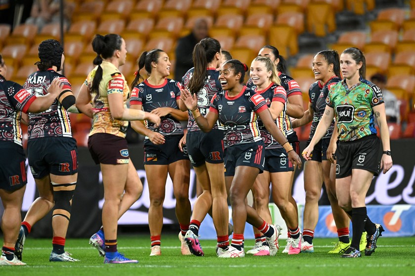 Taina Naividi celebrates with her Roosters team mates.