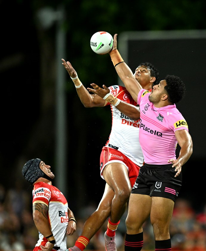Selwyn Cobbo goes up for a high ball against Paul Alamoti in Darwin.