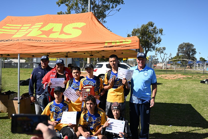 Ronny Gibbs and Nathan Blacklock with the Ronny Gibbs 7's Under 14's winners - Brewarrina Central School.