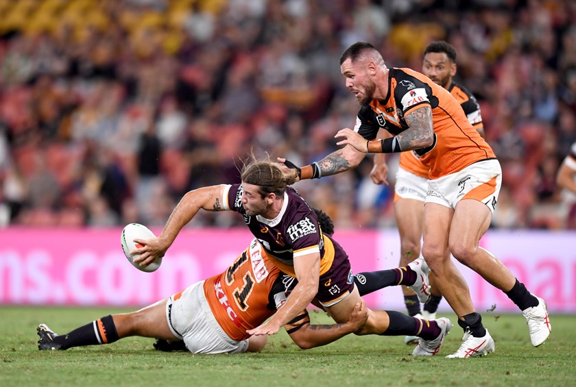 Pat Carrigan gets an offload away against Wests Tigers.