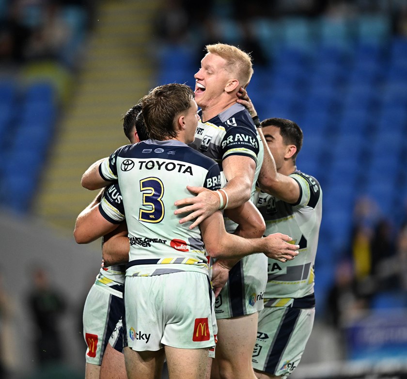 Griffin Neame helps lead the celebrations after a Cowboys try.