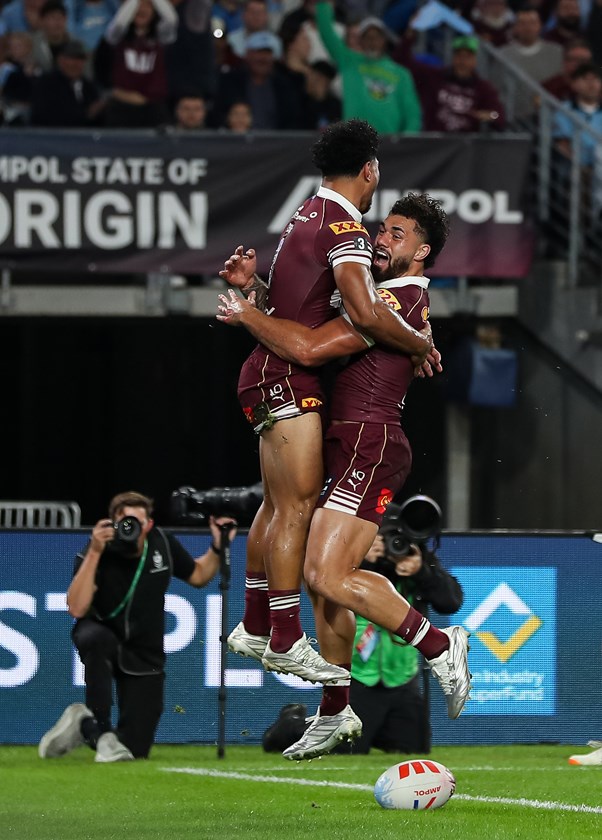 Rob Toia and fellow Under 19 Queensland graduate Jojo Fifita celebrate a try in Game One.