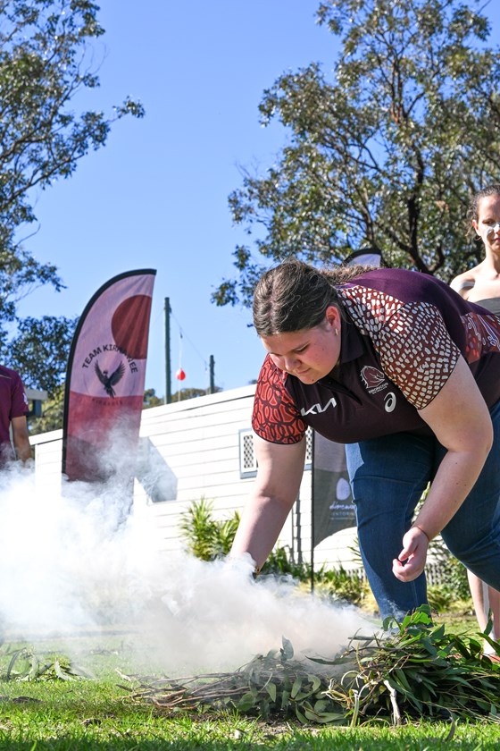 Students take part in a smoking ceremony during the summit.