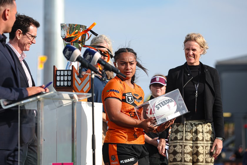 Evelyn Roberts receives her player of the match award following the 2025 BMD Premiership grand final.