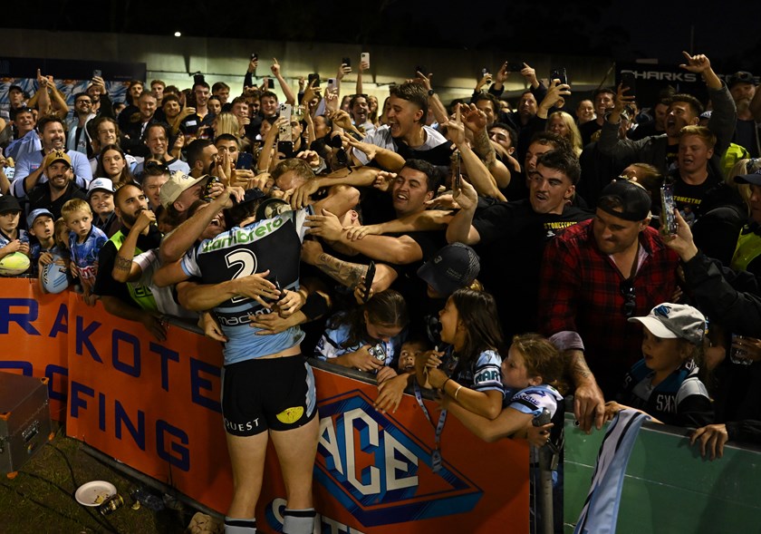 Sharks rookie Sam Stonestreet is mobbed by his friends and family following Sunday's NRL debut.