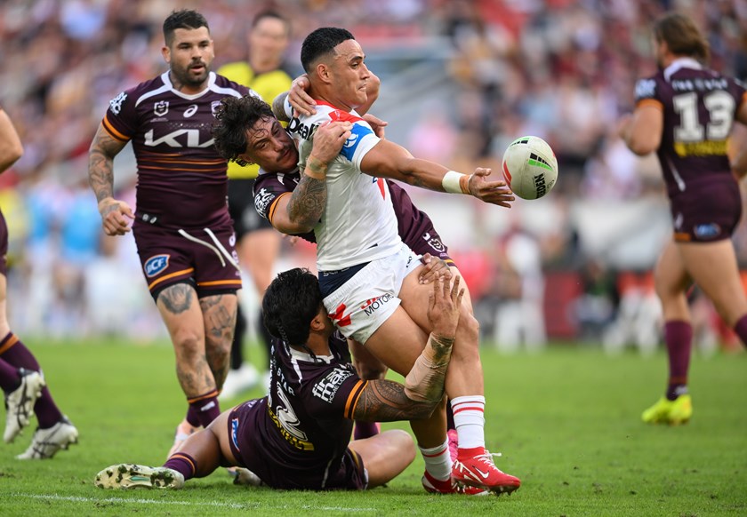 Valentine Holmes with an offload against the Broncos.