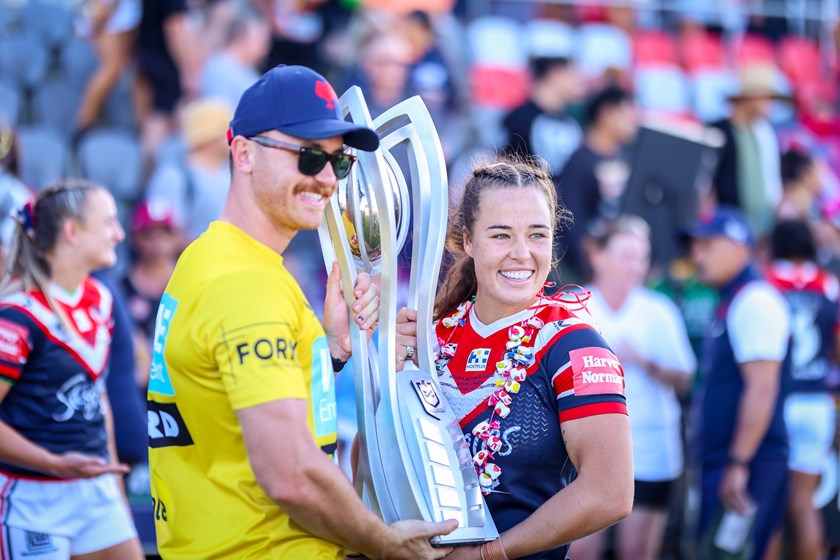 Isabelle Kelly and her partner Jake after the 2021 NRLW grand final.