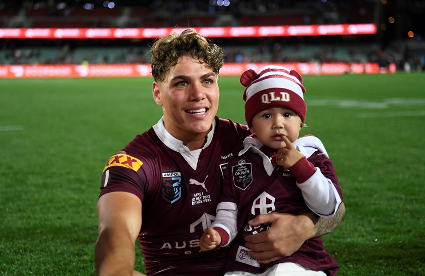 Reece Walsh with daughter Leila following Queensland's Game One win in Adelaide.