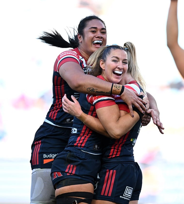 Roosters Jocelyn Keller, Tarryn Aiken and Otesa Pule celebrate.