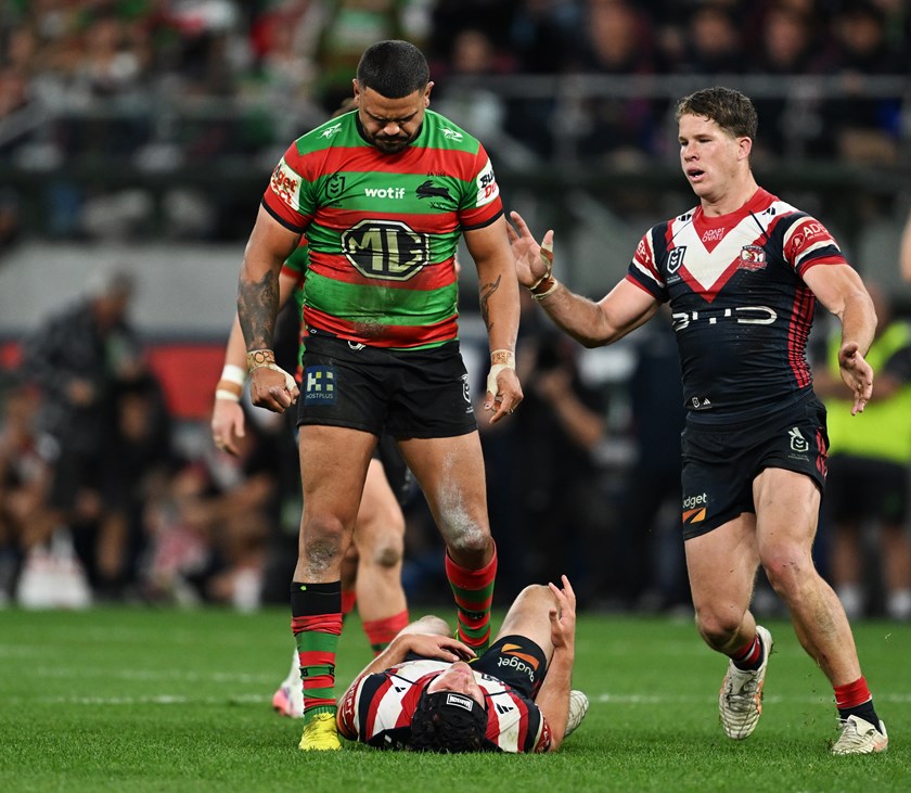 Latrell Mitchell celebrates his shot on Roosters youngster Toby Rodwell.