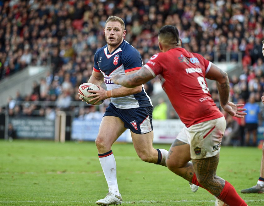 Tom Burgess in action for England in their first Test win over Tonga.