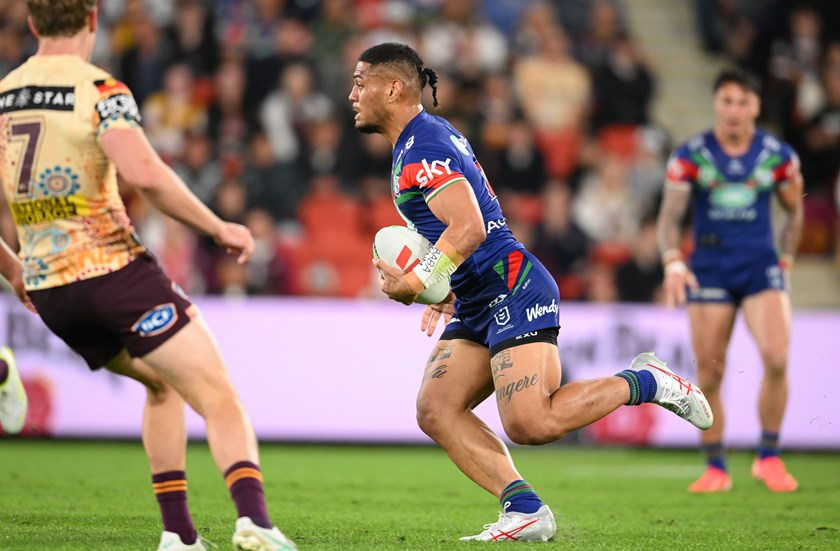 Leka Halasima runs the ball against the Broncos.