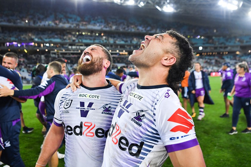 Jahrome Hughes and Kenny Bromwich celebrate the Storm's 2020 premiership win.