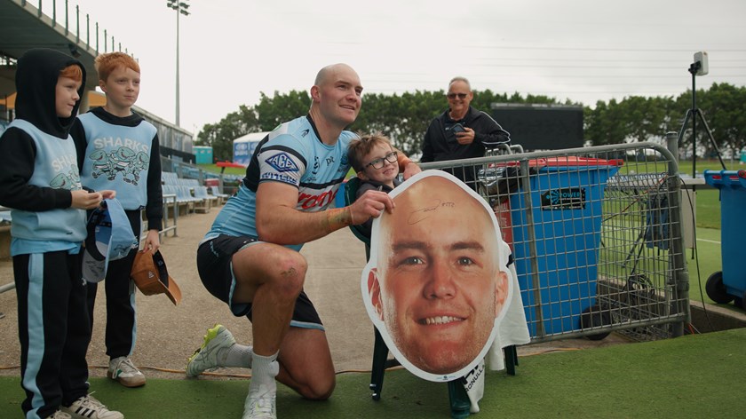 Tom Hazelton with young Sharks fan Coen, who is battling brain cancer.
