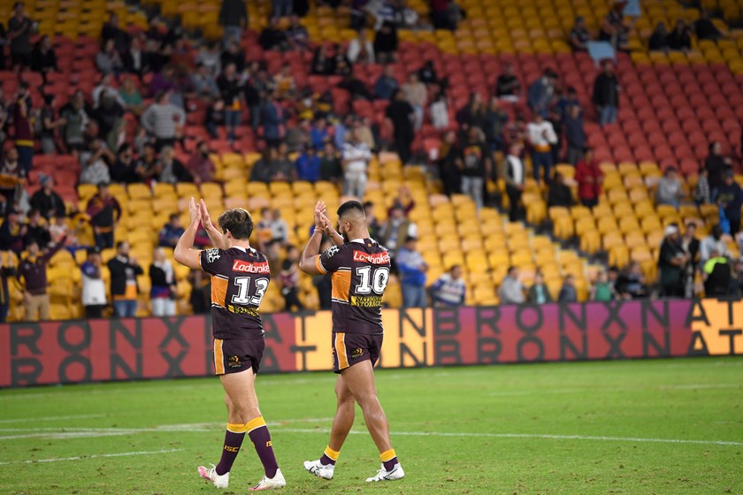 Pat Carrigan and Payne Haas celebrate a win over the Bulldogs in 2020.