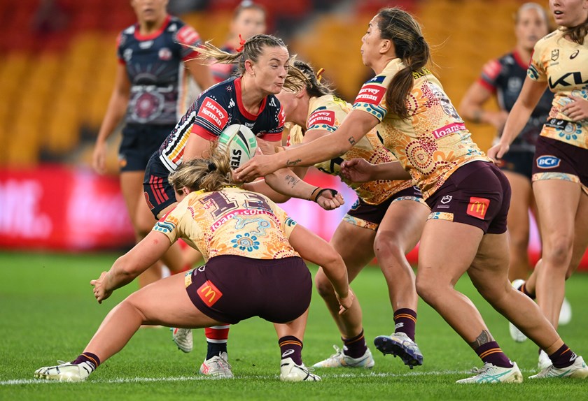 Brydie Parker takes the ball up against the Broncos.