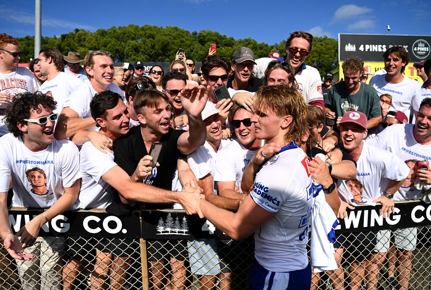 Jacob Preston is mobbed by family and friends after his NRL debut earlier this year.