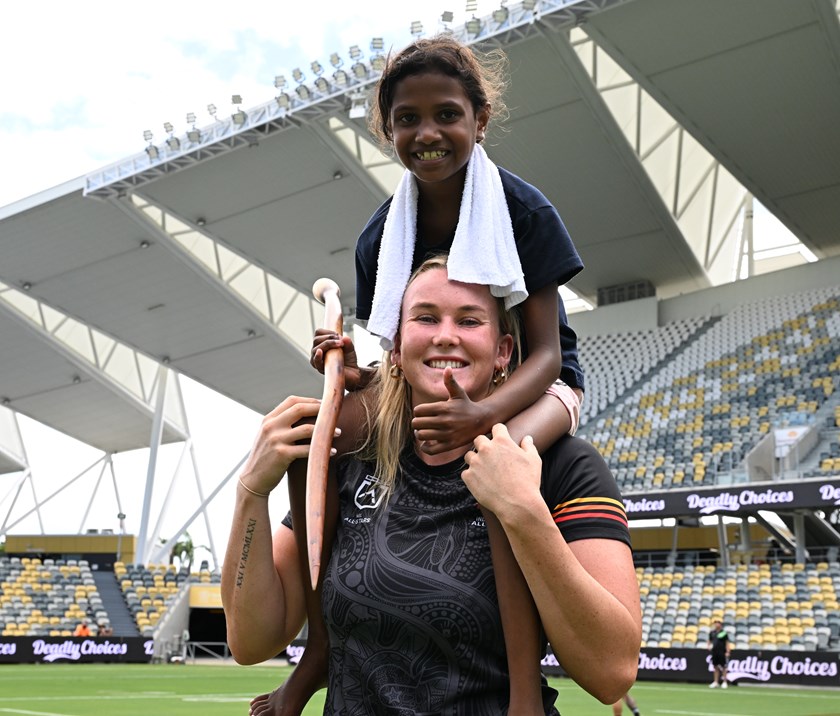 Jaime Chapman with a young fan at Indigenous Women's All Stars captain's run.