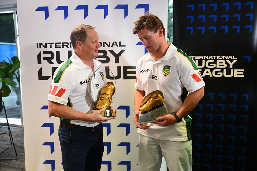Kangaroos coach Kevin Walters congratulates Harry Grant on his Golden Boot award.