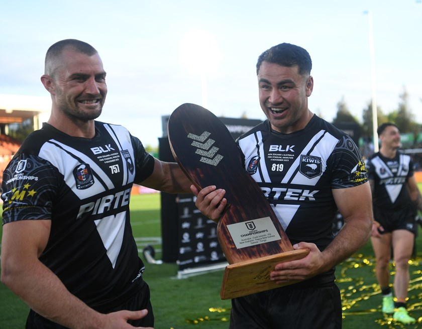 Kieran Foran and Jahrome Hughes with the Pacific Championships Trophy after winning the 2023 final.