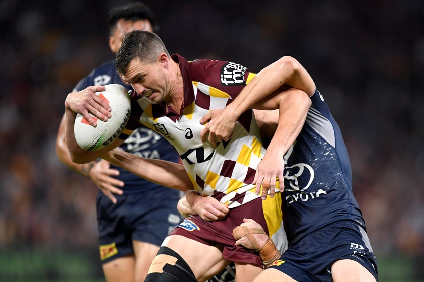 Corey Oates carts the ball for the Broncos against the Cowboys.