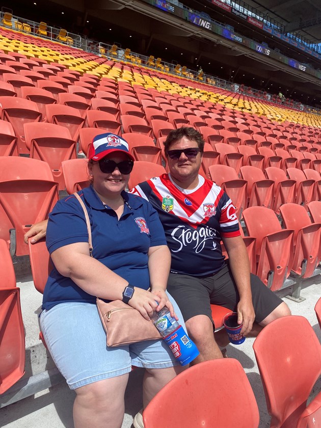 Amie Warner and Dean Lovelock were the first fans through the gate to see the Dolphins take on the Roosters in Round 1 at Suncorp Stadium. 